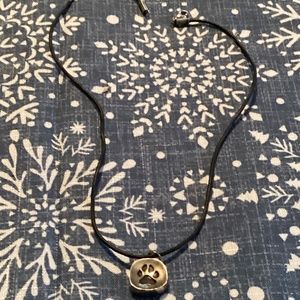 Pet paw nickel with black leather. Like new. Excellent condition.